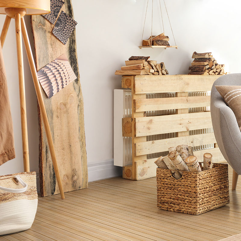 Basket,With,Firewood,Near,Sofa,Indoors.,Interior,Design